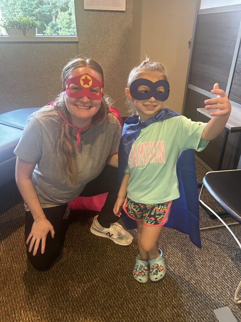 The Chiropractic Doctor team member with a young superhero at a Wyoming, MI community event
